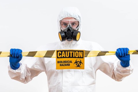 Man hazmat suit with danger sign