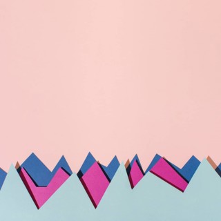 Top view colorful paper pink background