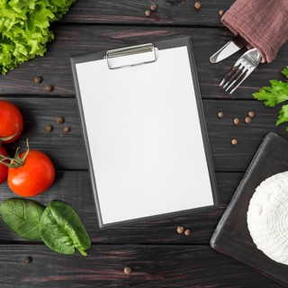 Top view empty menu with tomatoes spinach