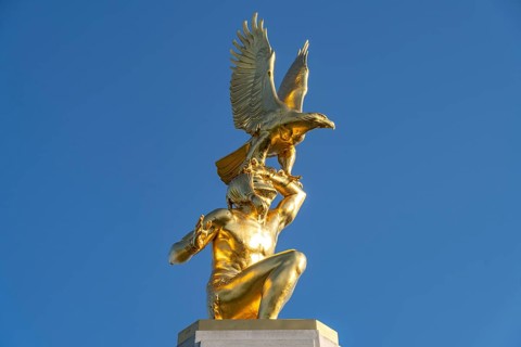 Golden Statue of a Native American with Eagle on the Tours American Monument Fountain