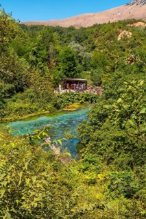 Tourists visiting The Blue eye or Syri i kalter