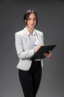 Portrait female lawyer formal suit with clipboard