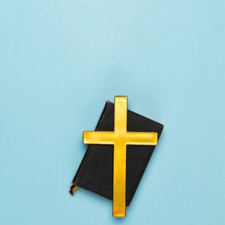 Top view holy bible with wooden cross