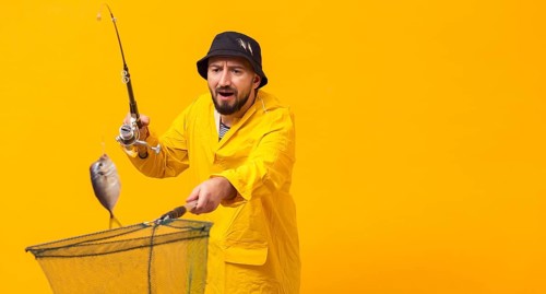 Front view fisherman holding fishing rod net with copy space