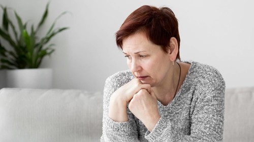 Front view woman with anxiety couch