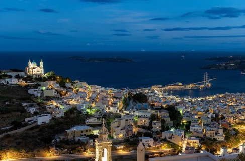 View of the illuminated town of Ermoupoli with Anastasi Church or Church of the Resurrection