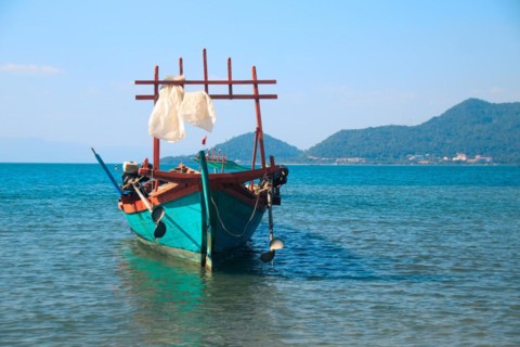 A traditional khmer fishing boat moored off the coast of Koh Tonsay or Rabbit Island in Cambodia