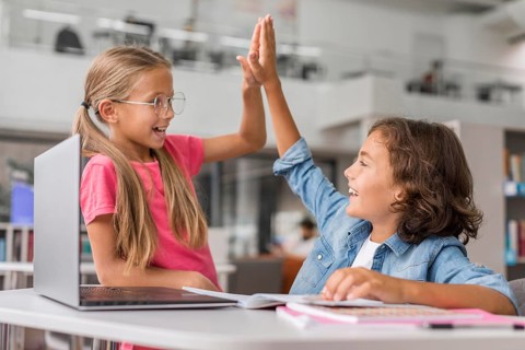 Kids high fiving library
