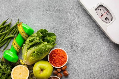 Scale with groceries gray background