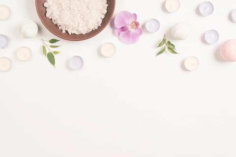 Sea salt orchid flower with candles white background forming top border