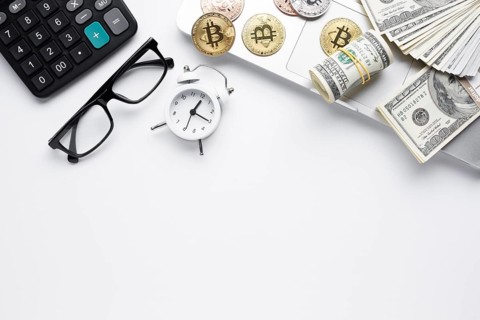 Top view coins paper money laptop