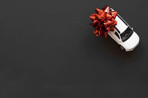 Toy car with red bow
