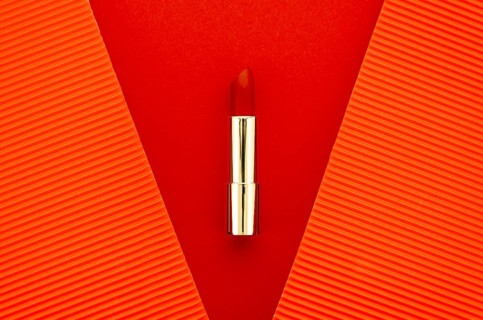 Red lipstick red background