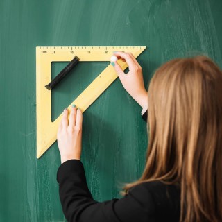 Woman drawing with triangular ruler blackboard