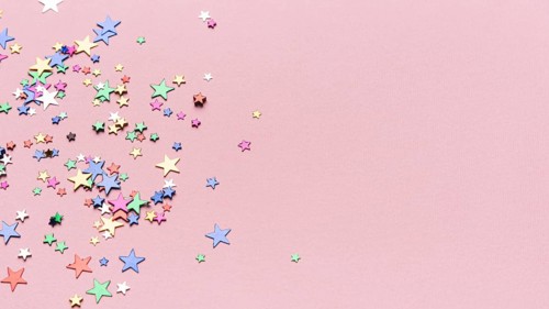 Confetti stars pink background with copy space