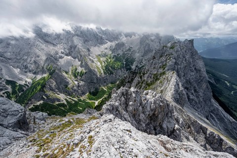 View from the summit of the Waxenstein over rocky and narrow ridge of the Waxenstein ridge to Hoellental with Jubilaeumsgrat
