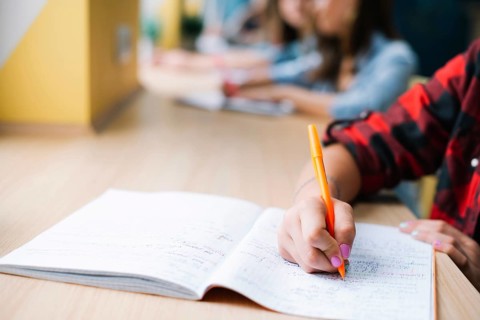 Anonymous student taking notes