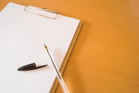 Ball pen clipboard with papers