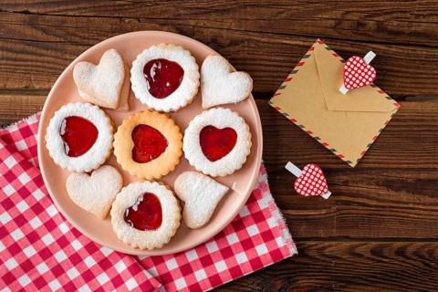 Top view heart shaped cookies plate with jam