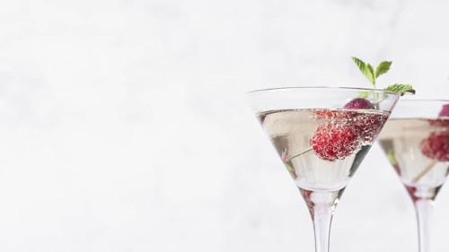 Alcoholic beverage cocktail with raspberry copy space