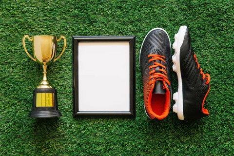 Football composition with frame trophy shoes