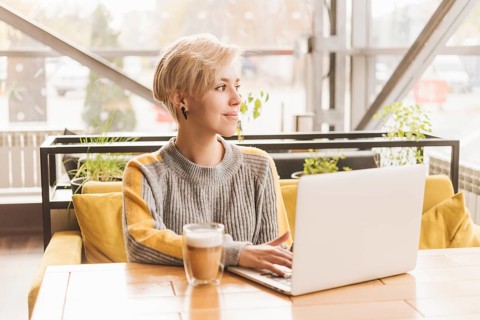 Lance woman working with laptop coffee shop