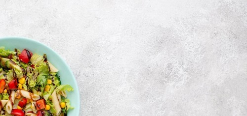 Top view pasta salad with balsamic vinegar copy space