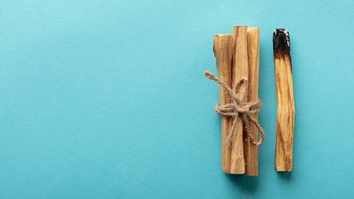 Wooden aromatic sticks tied with rope copy space