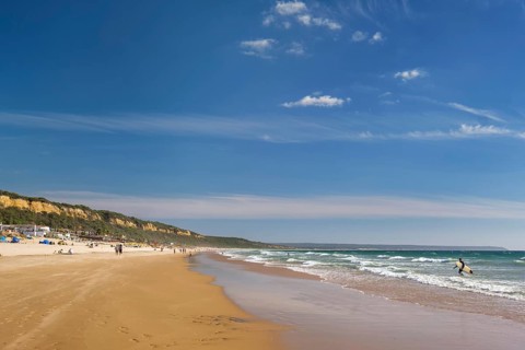 Sandy Atlantic ocean beach at Fonte da Telha beach