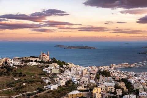 View of the town of Ermoupoli with Anastasi Church or Church of the Resurrection at sunset