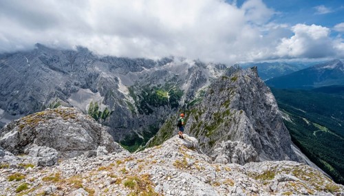 Mountaineer at the summit of the Waxenstein