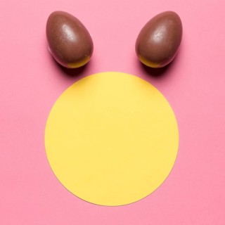 Easter eggs like bunny ear s round paper blank frame against pink backdrop