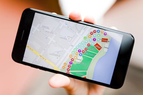 Close up person s hand holding smartphone with map gps navigation