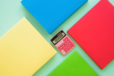 Colorful books with calculator center