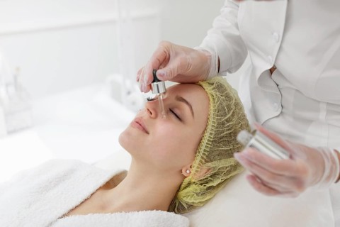 Woman beauty clinic face treatment