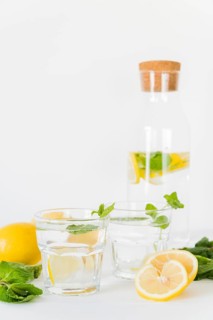 Glasses bottle with lemon mint drink
