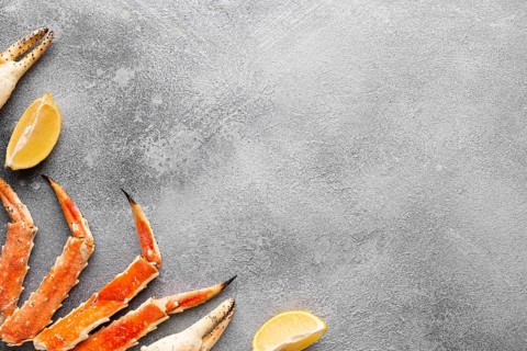 Top view lobster with lemons copy space