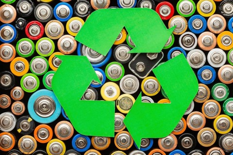 Battery pollution waste with recycle symbol