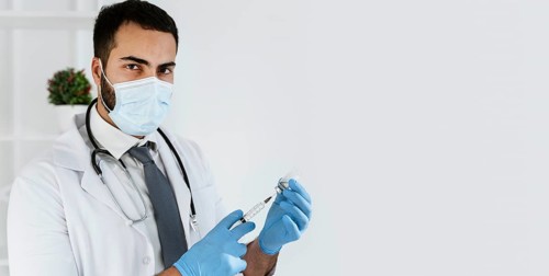 Doctor preparing vaccine with copy space