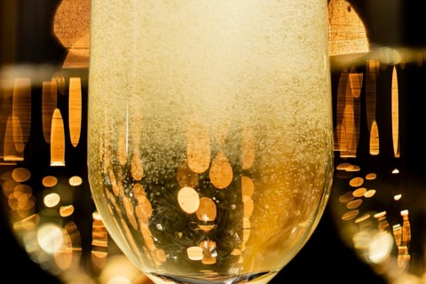 Close up champagne bubbles glasses