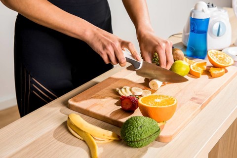 Fitness woman preparing detox juice