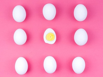 White chicken eggs with boiled egg table