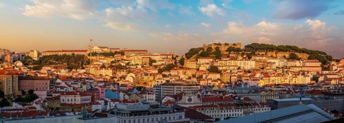 View of Lisbon city from Miradouro de Sao Pedro de Alcantara viewpoint on sunset. Lisbon