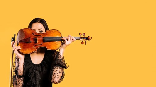 Girl hiding violin