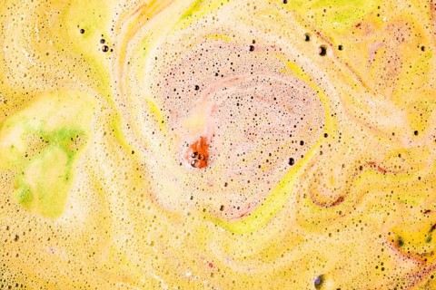 Foam bubbles form surface bath bomb dissolve water