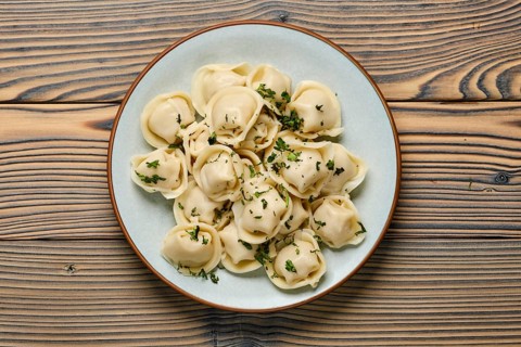 Top view of plate with dumplings stuffed with meat