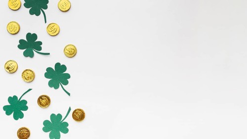 Flat lay coins clovers frame