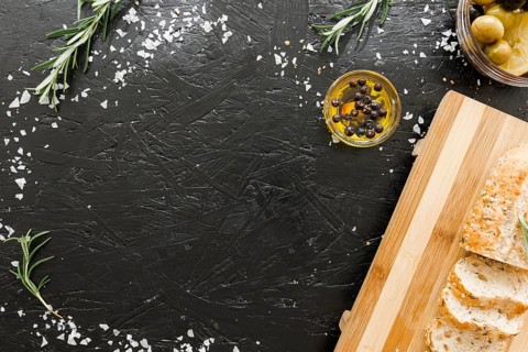 Table with cutting board bread with oil