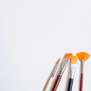 Paintbrushes white surface