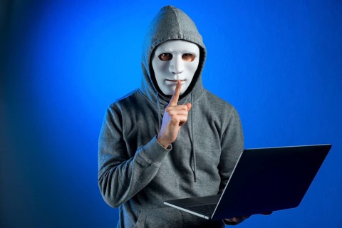 Portrait hacker with mask
